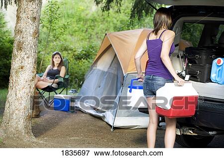 Stock Photo - Two women camping. Fotosearch