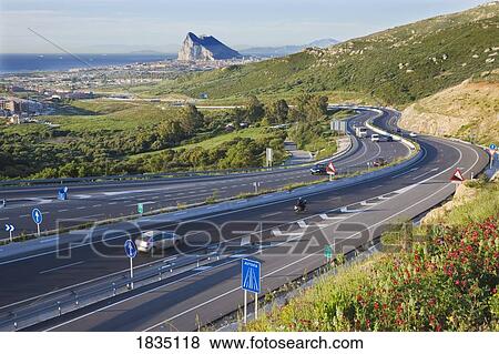 Stock Photo - View of Gibraltar with Africa from the A383 autopista near La Línea de la Concepción, Cadiz Province, Spain. Fotosearch