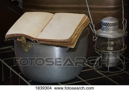 Weathered antique Bible in antique period kitchen View Large Photo Image Picture - Weathered antique Bible in antique period kitchen . Fotosearch