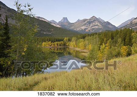 Stock Image - Wedge Pond, Kananaskis, Alberta, Canada; Canadian Rockies during Autumn. Fotosearch