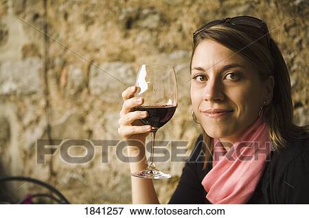 Stock Photo - Woman holding wine glass. Fotosearch