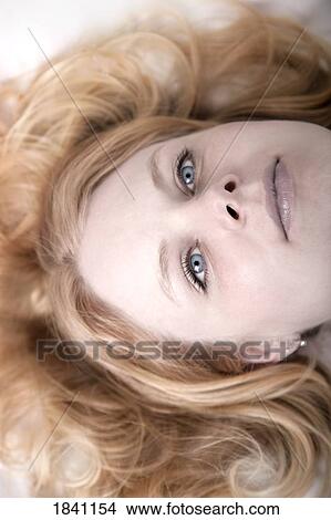 Woman laying down View Large Photo Image Picture - Woman laying down. Fotosearch