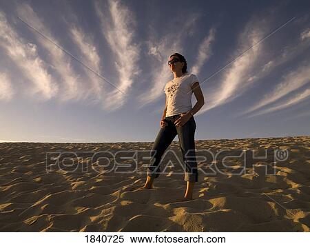 Stock Photography - Woman on the beach. Fotosearch