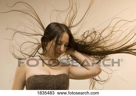 Woman with blowing hair View Large Photo Image Stock Image - Woman with blowing hair. Fotosearch