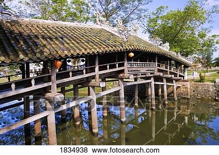 Stock Photo - Wooden bridge in Thua Thien-Hue, Vietnam . Fotosearch