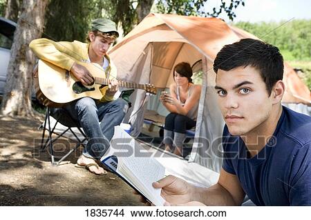 Picture - Young people at a campsite. Fotosearch
