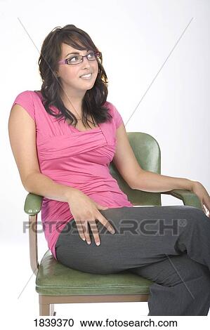 Stock Image - Young woman sitting. Fotosearch