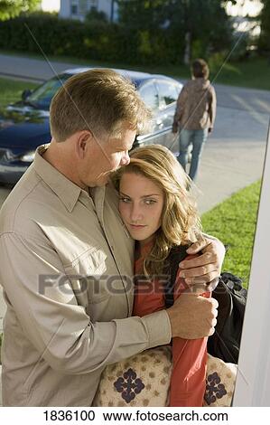 Young woman visiting dad with mother leaving View Large Photo Image Stock Image - Young woman visiting dad with mother leaving. Fotosearch