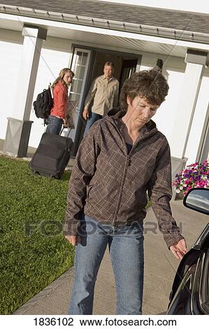 Young woman visiting dad with mother leaving View Large Photo Image Stock Image - Young woman visiting dad with mother leaving. Fotosearch