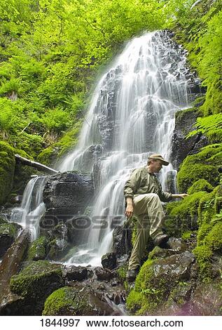 Stock Photo - A hiker at Fairy Falls, Oregon, United States of America. Fotosearch