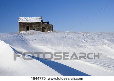Alberta, Canada; Abandoned farm building atop a snowy hill View Large Photo Image Stock Photography - Alberta, Canada; Abandoned farm building atop a snowy hill. Fotosearch