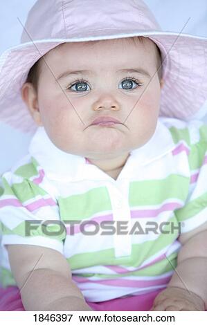 Baby girl wearing hat View Large Photo Image Stock Photo - Baby girl wearing hat. Fotosearch