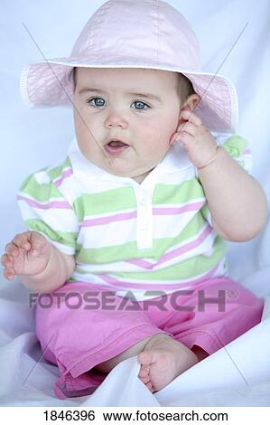 Baby girl wearing hat View Large Photo Image Stock Photograph - Baby girl wearing hat. Fotosearch