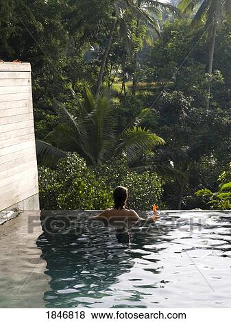 Bali Indonesia; Woman in a pool View Large Photo Image Stock Photo - Bali Indonesia; Woman in a pool. Fotosearch
