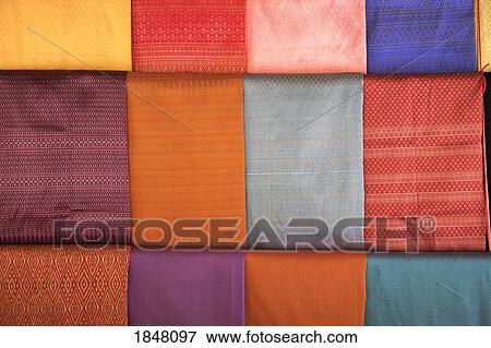 Ban Tha Sawang, Thailand; Colorful silk weaving View Large Photo Image Stock Photo - Ban Tha Sawang, Thailand; Colorful silk weaving . Fotosearch