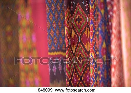 Ban Tha Sawang, Thailand; Colorful silk weaving View Large Photo Image Stock Photo - Ban Tha Sawang, Thailand; Colorful silk weaving . Fotosearch