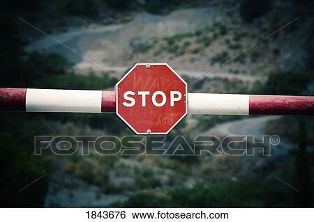 Barrier with stop sign View Large Photo Image Stock Photograph - Barrier with stop sign. Fotosearch