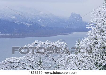 Stock Photo - Beacon Rock, Columbia River Gorge, Oregon, USA; Beacon Rock and Columbia River with fresh snow. Fotosearch