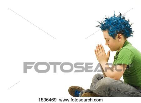 Blue haired boy praying View Large Photo Image Stock Photo - Blue haired boy praying. Fotosearch