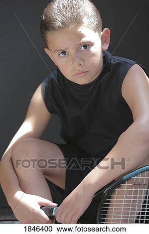 Stock Image - Boy holding racquet. Fotosearch