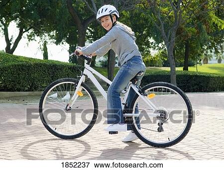 Boy on bike; Child rides on bicycle View Large Photo Image Stock Photo - Boy on bike; Child rides on bicycle. Fotosearch
