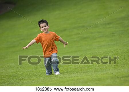 Boy on grass; boy running outside View Large Photo Image Stock Photography - Boy on grass; boy running outside. Fotosearch