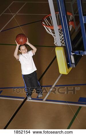 Boy playing basketball View Large Photo Image Picture - Boy playing basketball. Fotosearch
