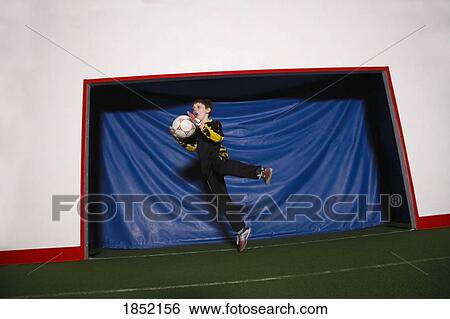 Boy playing soccer View Large Photo Image Stock Photograph - Boy playing soccer. Fotosearch