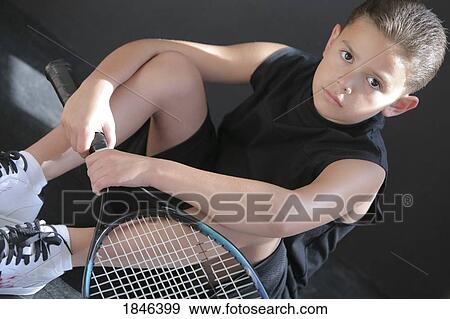 Stock Photo - Boy with racquet. Fotosearch