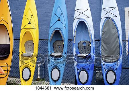 Stock Image - Bracebridge, Muskokas, Ontario, Canada; Kayaks stacked up against a wall. Fotosearch