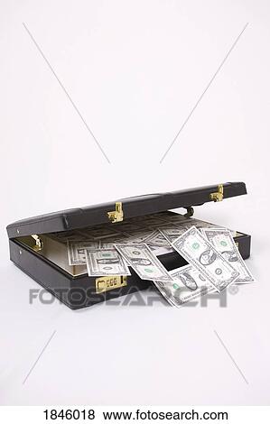 Stock Photo - Briefcase with money spilling out. Fotosearch