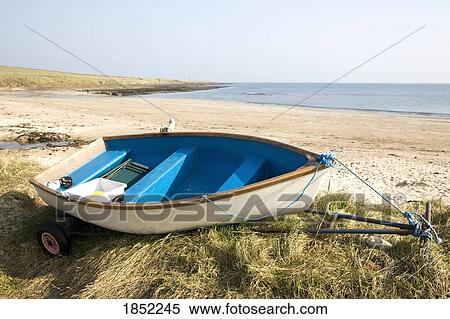 Stock Photography - Canoe on shore. Fotosearch