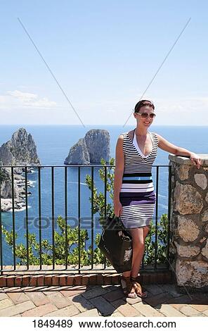 Capri, Italy; Woman standing on Vista point View Large Photo Image Stock Photo - Capri, Italy; Woman standing on Vista point. Fotosearch