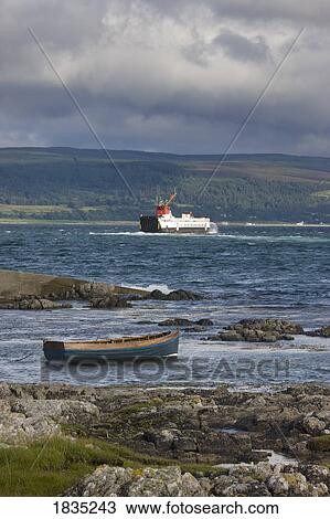 Stock Image - Cargo ship on the water. Fotosearch