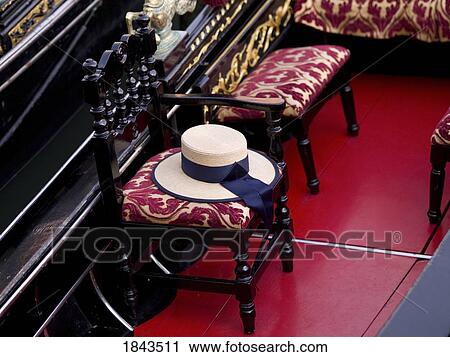 Stock Image - Chairs and hat, Venice, Italy . Fotosearch