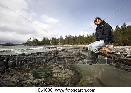 Chesterman's Beach, near Tofino, British Columbia, Canada; Man sitting down View Large Photo Image Stock Photograph - Chesterman's Beach, near Tofino, British Columbia, Canada; Man sitting down. Fotosearch