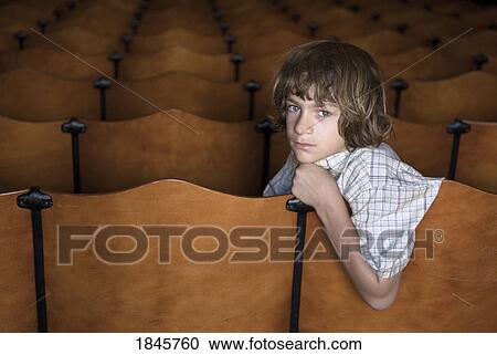 Stock Image - Child sitting all alone. Fotosearch