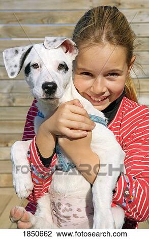 Stock Image - Child with a dog. Fotosearch