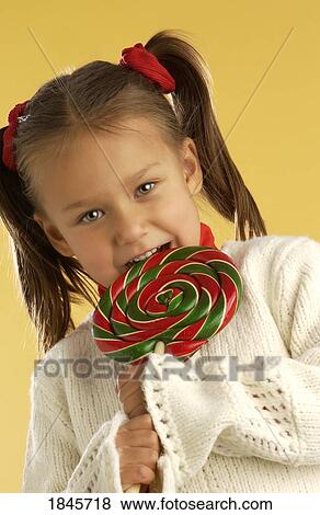 Child with a lollipop View Large Photo Image Stock Photo - Child with a lollipop. Fotosearch