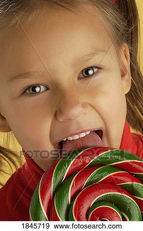 Stock Photo - Child with a lollipop. Fotosearch