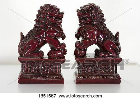 Chinese lions; Figurines of lions believed to have mythic protective powers in Chinese mythology View Large Photo Image Stock Photo - Chinese lions; Figurines of lions believed to have mythic protective powers in Chinese mythology. Fotosearch