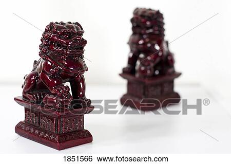 Chinese lions; Figurines of lions believed to have mythic protective powers in Chinese mythology View Large Photo Image Stock Photograph - Chinese lions; Figurines of lions believed to have mythic protective powers in Chinese mythology . Fotosearch