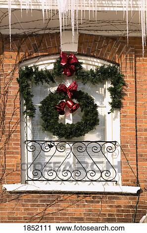 Stock Image - Christmas decorations on exterior of building, Waterloo, Quebec, Canada. Fotosearch