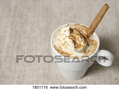 Cinnamon stick in coffee drink View Large Photo Image Stock Photograph - Cinnamon stick in coffee drink. Fotosearch