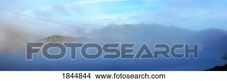 Co Kerry, Ireland; Early morning mist over Barfinnihy Lake with the Reeks in the background View Large Photo Image Picture - Co Kerry, Ireland; Early morning mist over Barfinnihy Lake with the Reeks in the background. Fotosearch