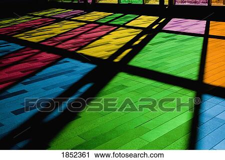 Stock Image - Colorful windows; Reflection of stained glass window on the floor. Fotosearch