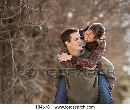 Stock Image - Couple being playful. Fotosearch