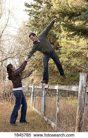 Couple being playful View Large Photo Image Stock Photography - Couple being playful. Fotosearch