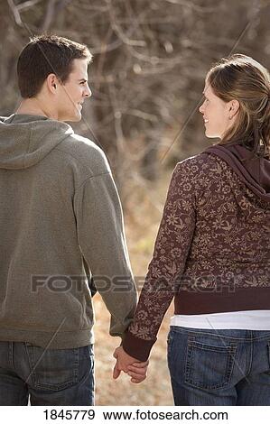 Couple holding hands View Large Photo Image Stock Photo - Couple holding hands. Fotosearch