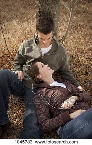 Couple listening to music View Large Photo Image Stock Image - Couple listening to music. Fotosearch
